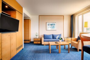 Deluxe Suite, River View | Living area | 42-inch TV with digital channels