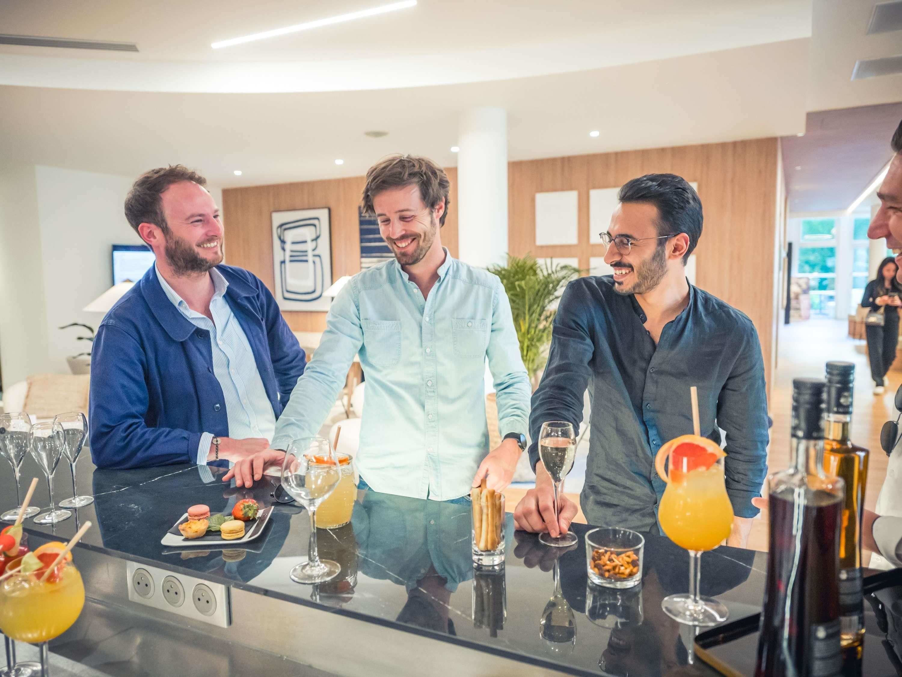 A bar area with a glass counter, various drinks, and snacks.