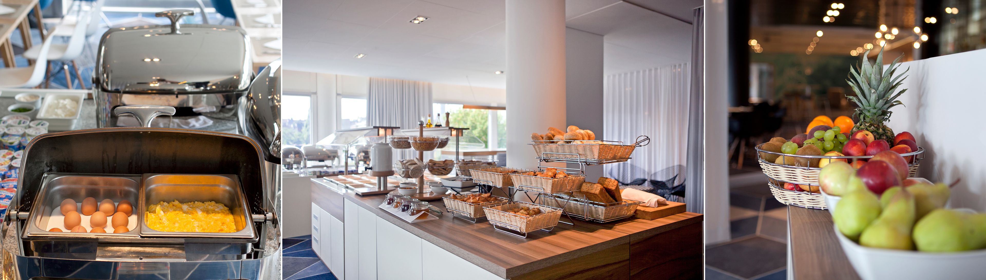 Un buffet proposant une variété de plats et une présentation attrayante de fruits.