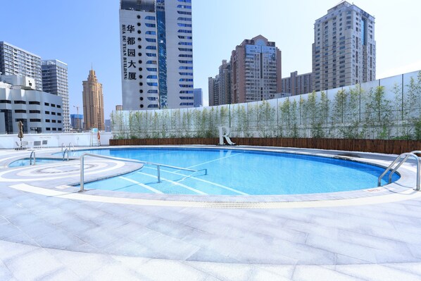 Seasonal outdoor pool, open 8:00 AM to 9:00 PM, pool umbrellas