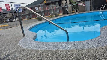 Seasonal outdoor pool, pool loungers