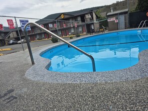 Seasonal outdoor pool, pool loungers