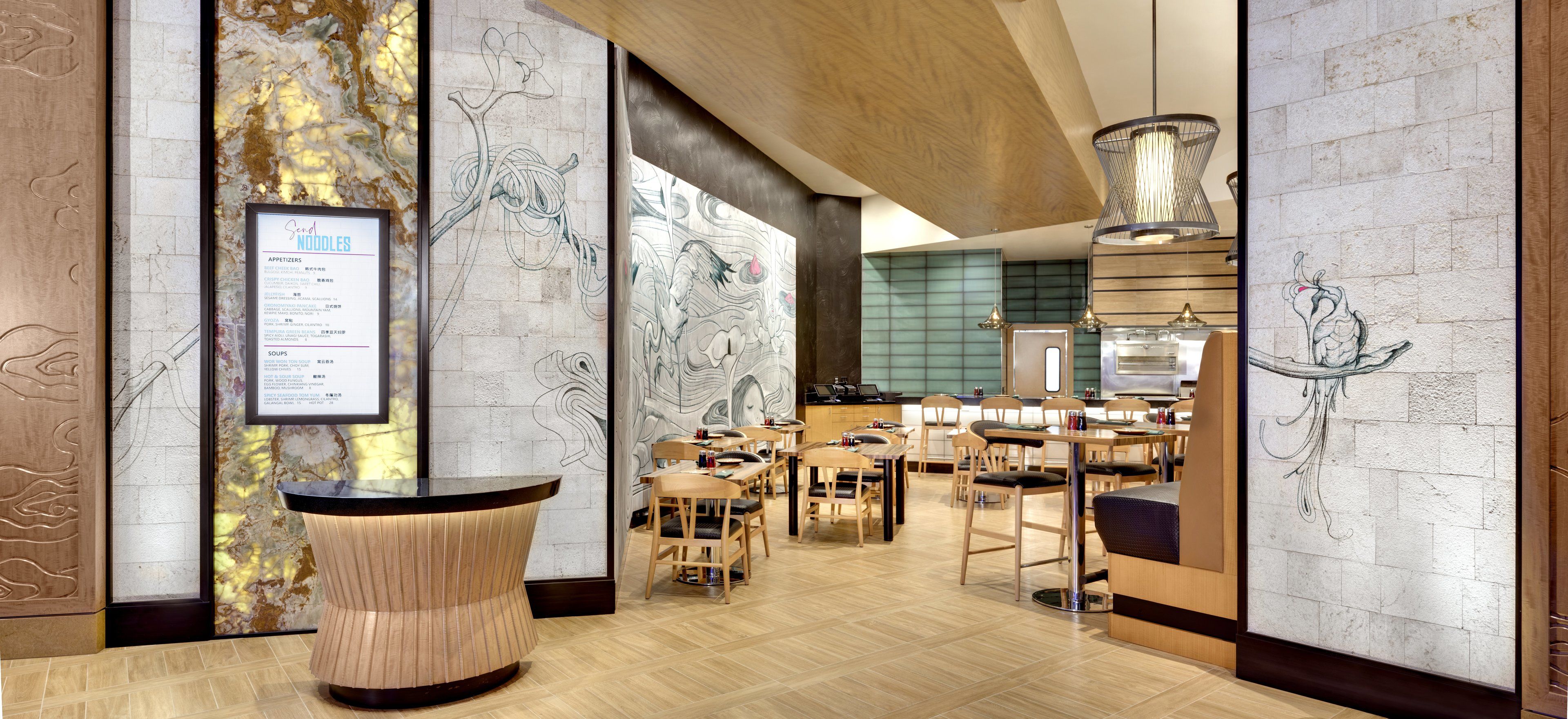 A restaurant with a menu board, wooden chairs, and a modern interior design.