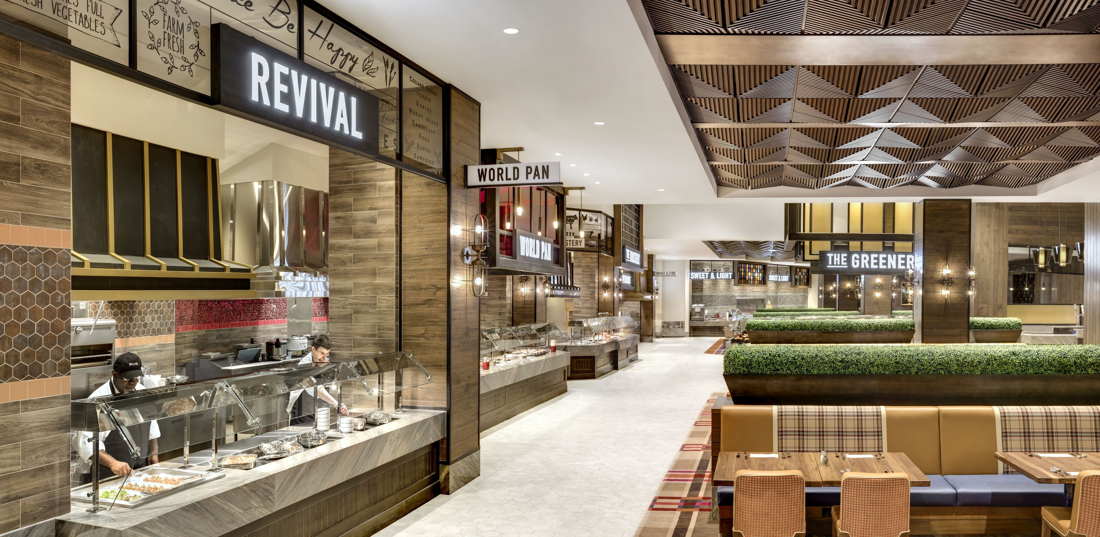 A modern restaurant with a buffet area, a seating area with tables and chairs, and a decorative ceiling.