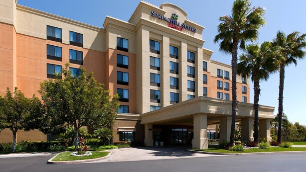 A hotel with a modern facade, multiple floors, and a prominent entrance. - SpringHill Suites Los Angeles LAX/Manhattan Beach (Hawthorne)