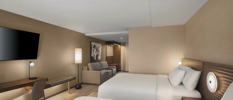 Habitación de hotel con dos camas, un escritorio, una silla, un televisor de pantalla plana y una obra de arte colgada en la pared.