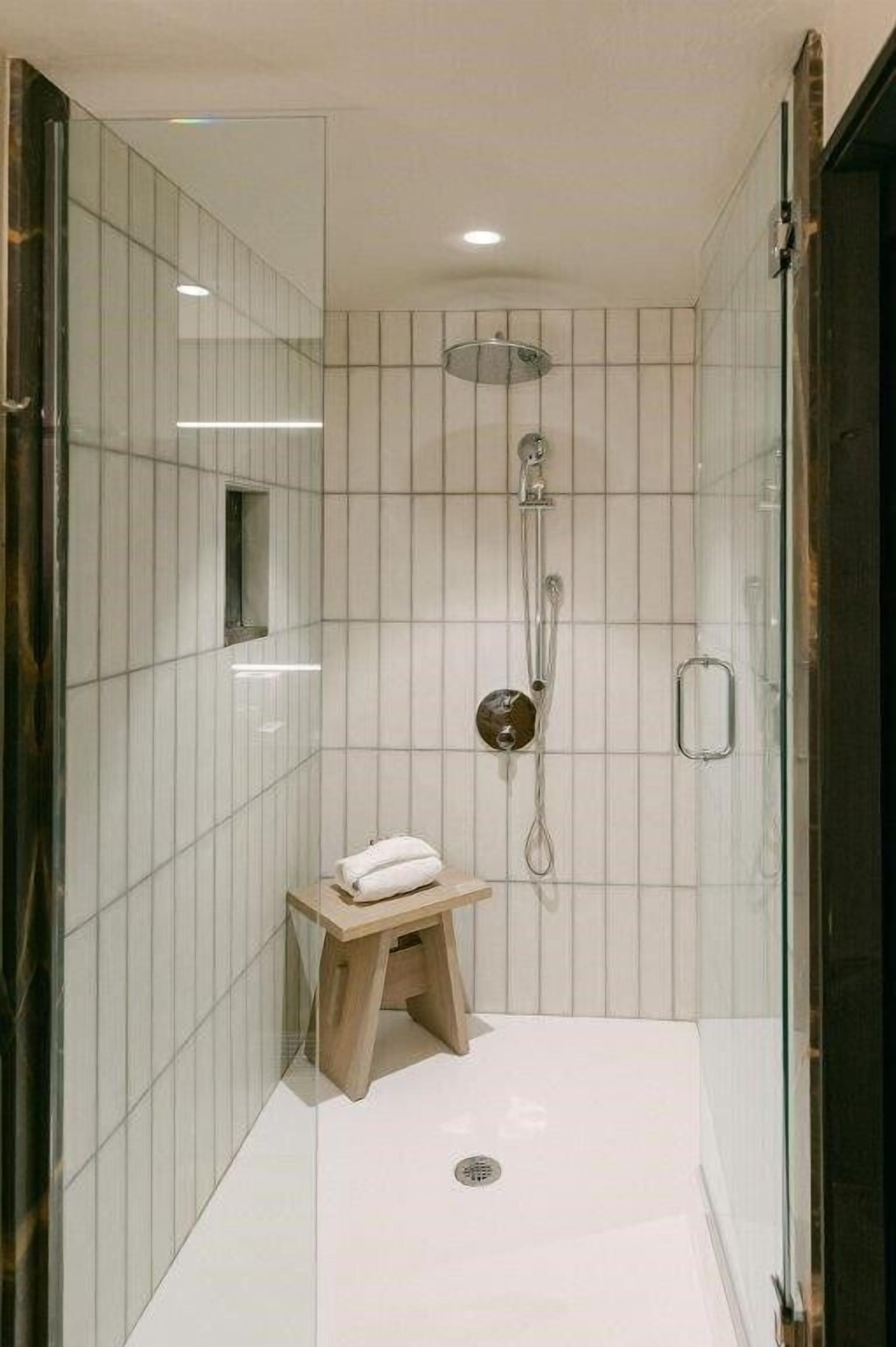 shower, designer toiletries, hair dryer, towels