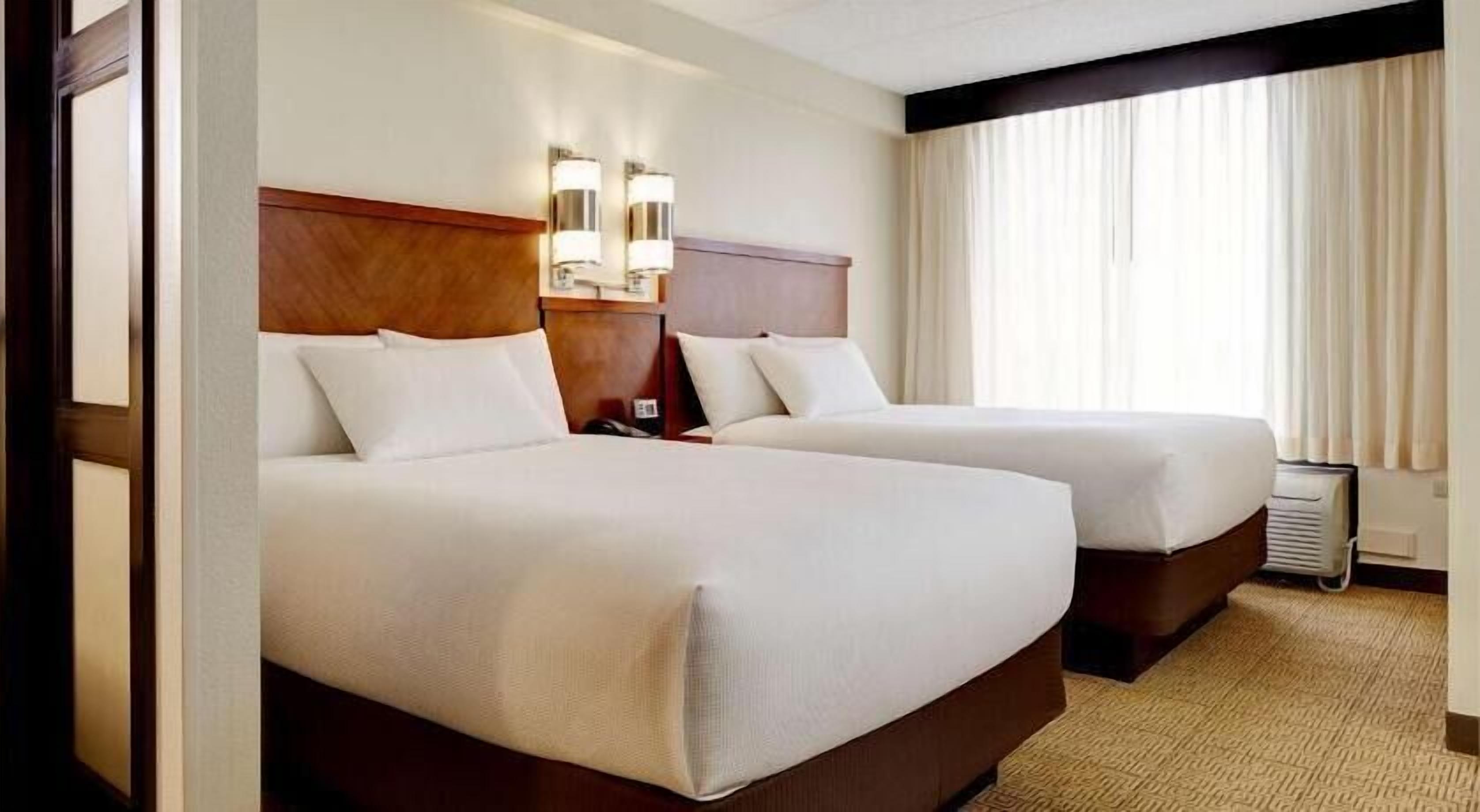 Hypo-allergenic bedding, down comforters, desk, blackout drapes
