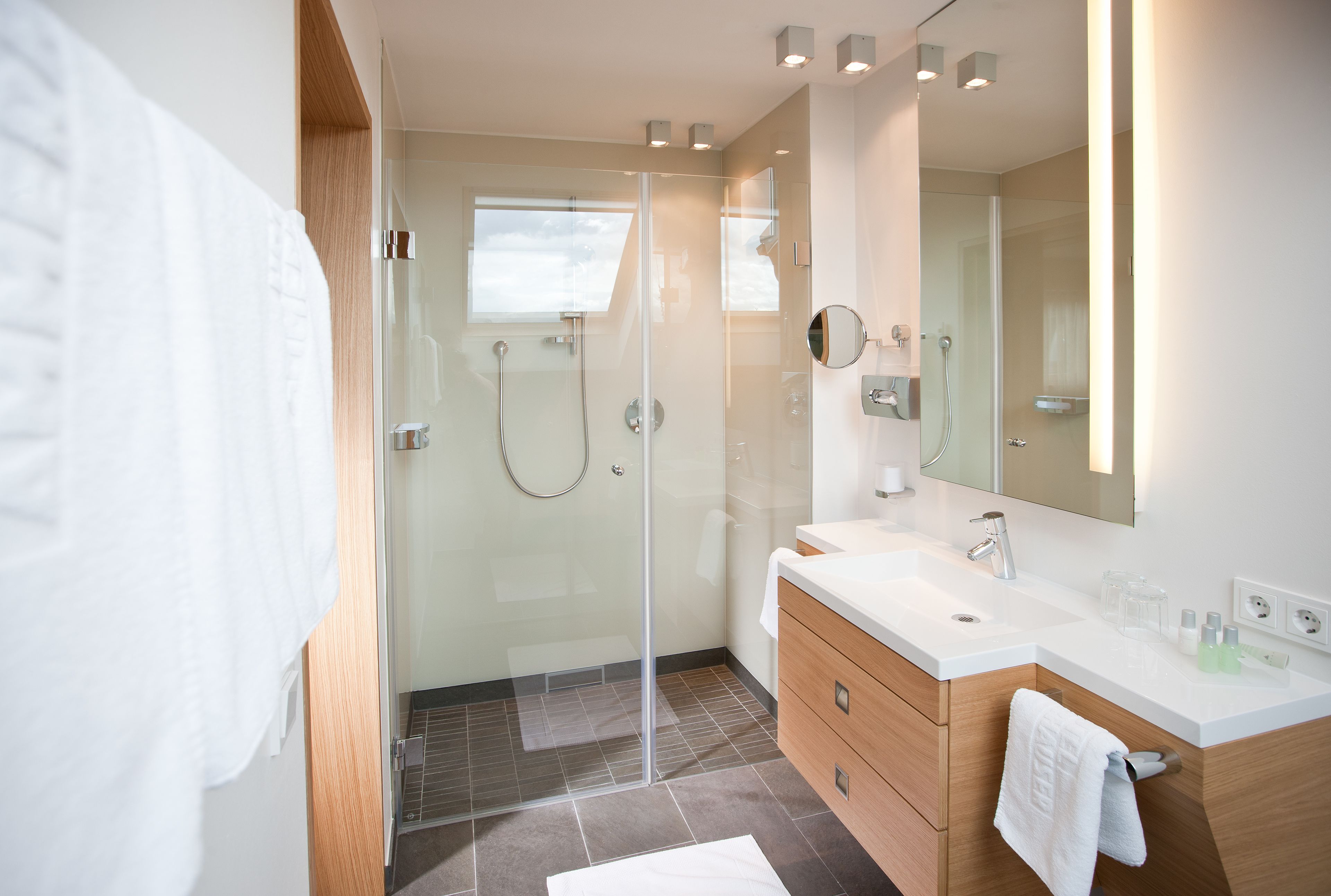 eco-friendly toiletries, hair dryer, bathrobes, slippers