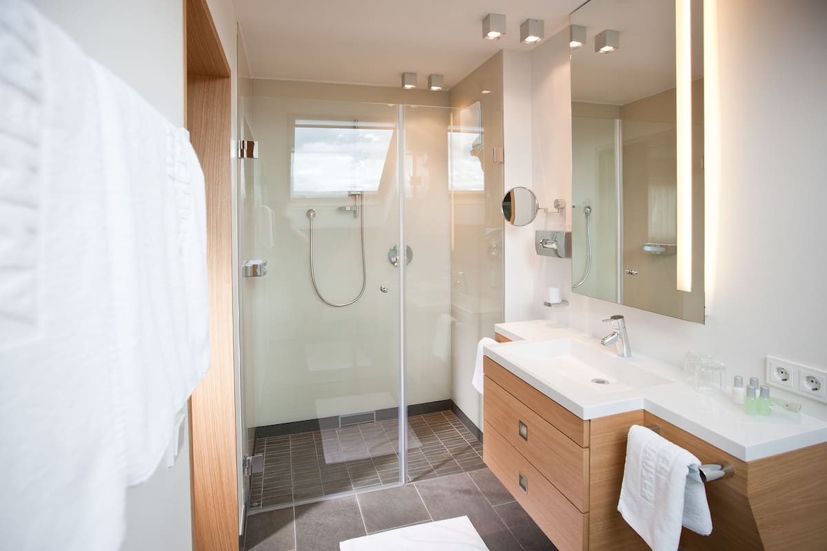 eco-friendly toiletries, hair dryer, bathrobes, slippers