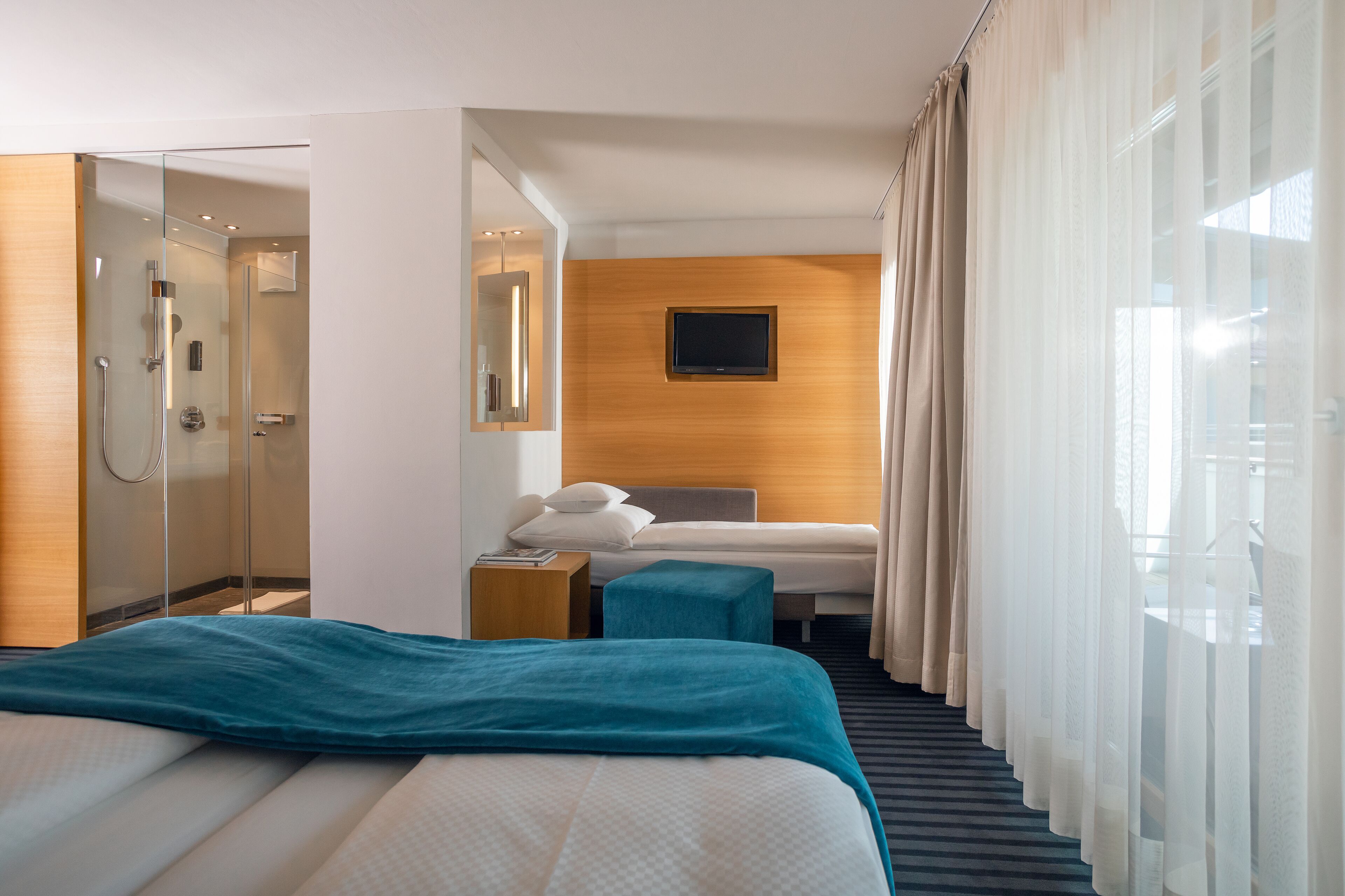 Triple Room | Minibar, in-room safe, individually furnished, desk