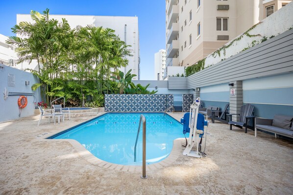 Outdoor pool, open 8:00 AM to 11:00 PM, sun loungers