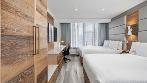 A modern hotel room with two beds, a desk, and a TV. - Holiday Inn Express San Juan Condado by IHG (San Juan)