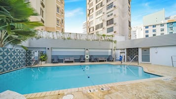 Outdoor pool, open 8:00 AM to 11:00 PM, pool loungers