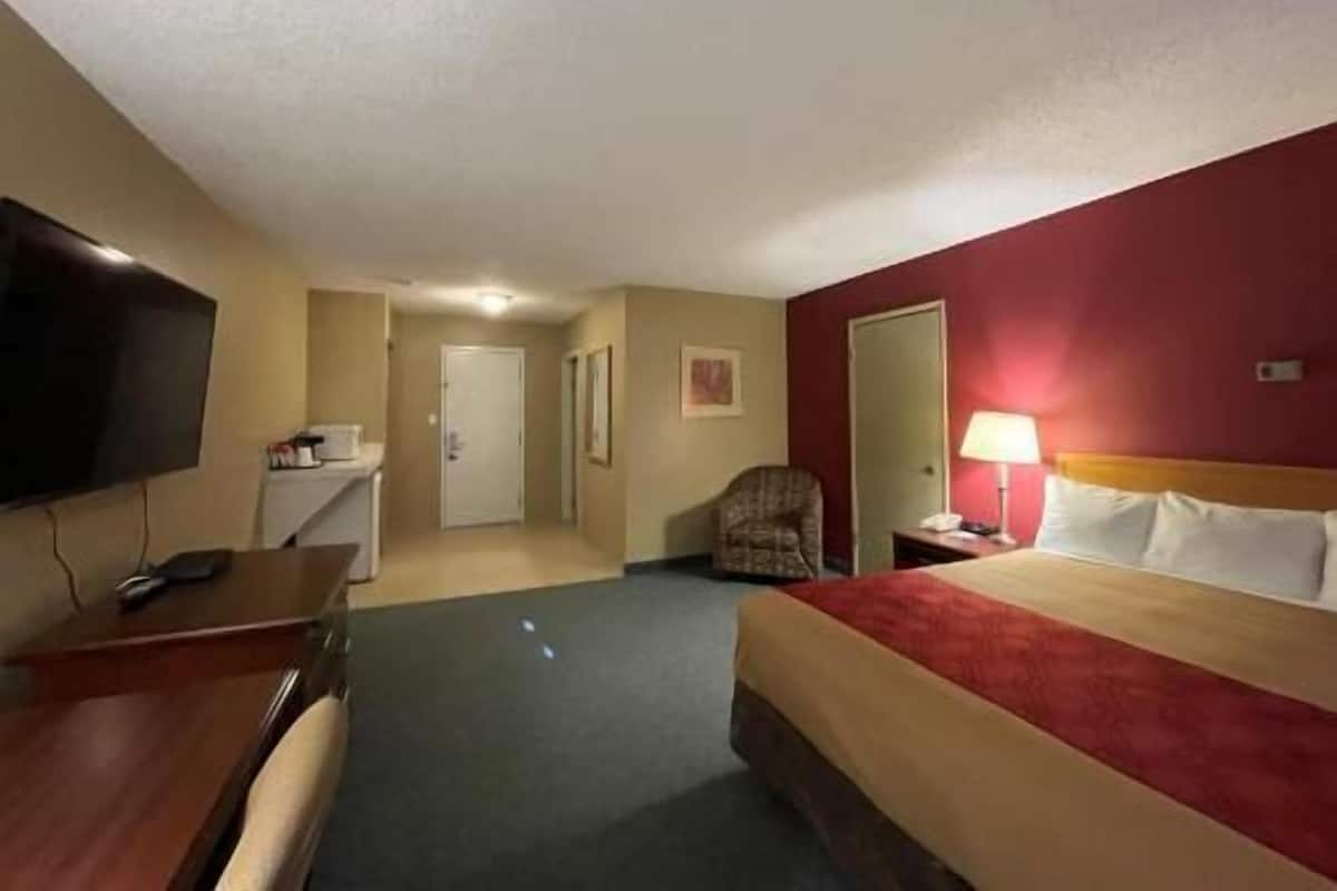 Desk, laptop workspace, blackout curtains, iron/ironing board