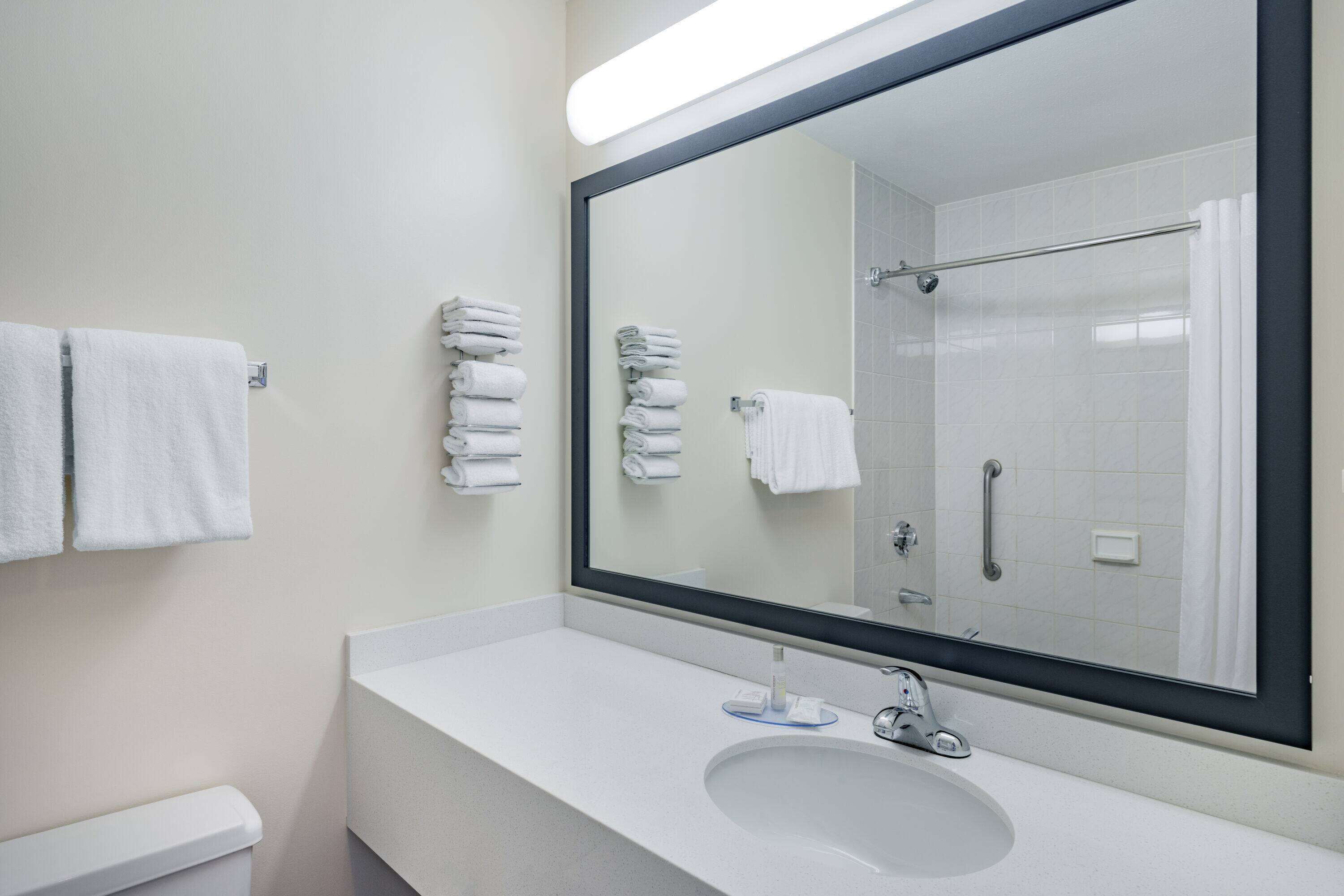 Combined shower/bathtub, deep-soaking bathtub, towels