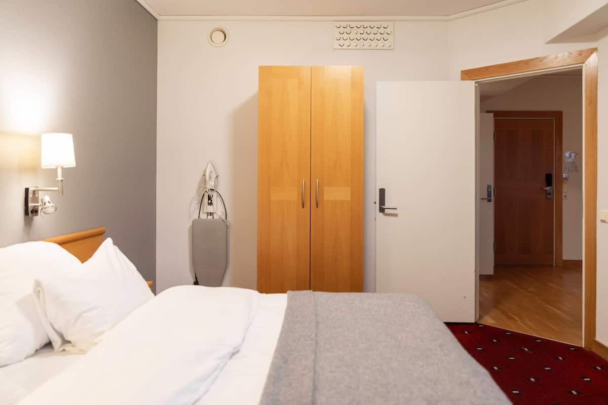 Suite, Non Smoking, Balcony | Blackout curtains, iron/ironing board, bed sheets