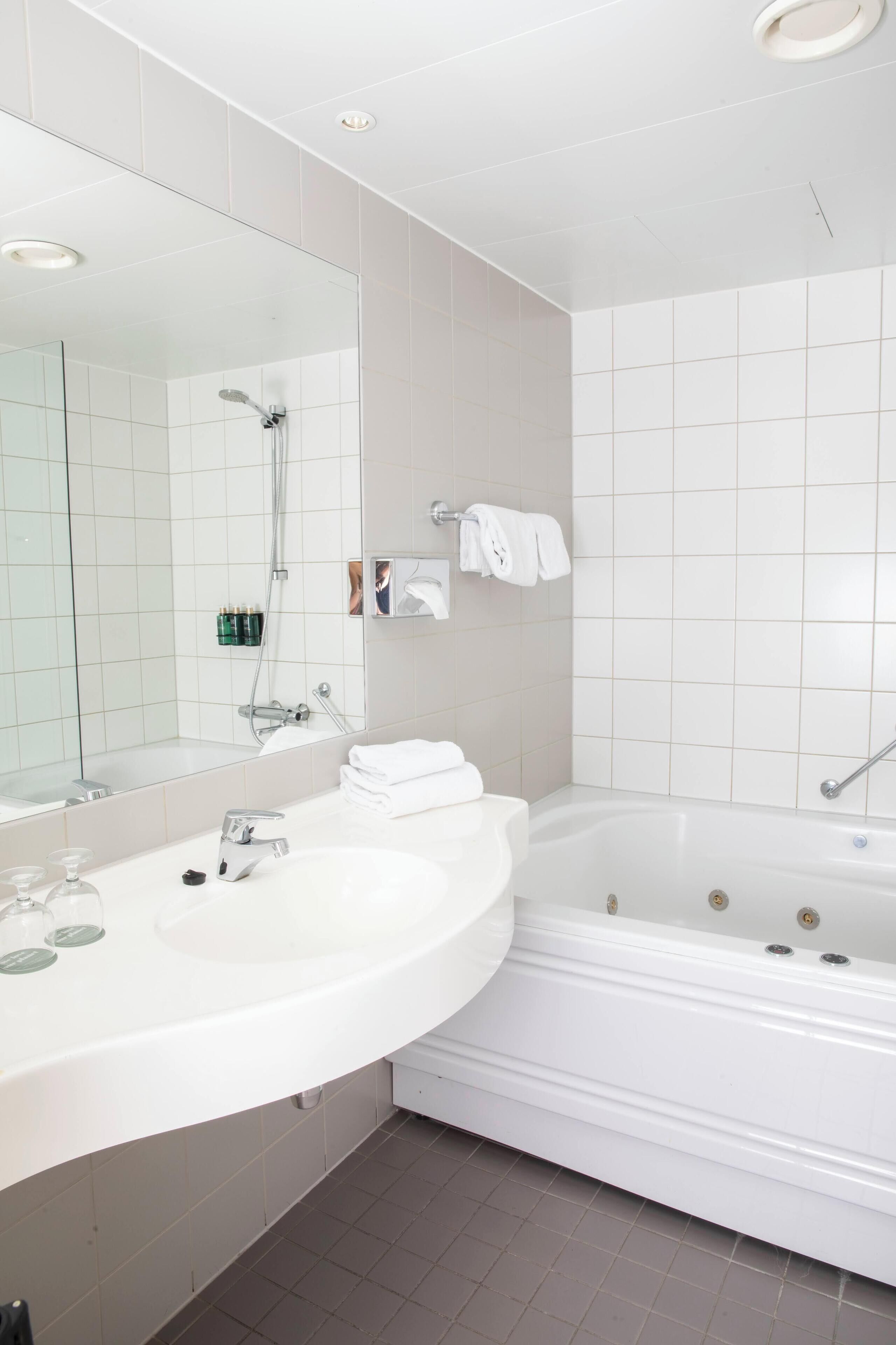 deep-soaking bathtub, hair dryer, heated floors, towels