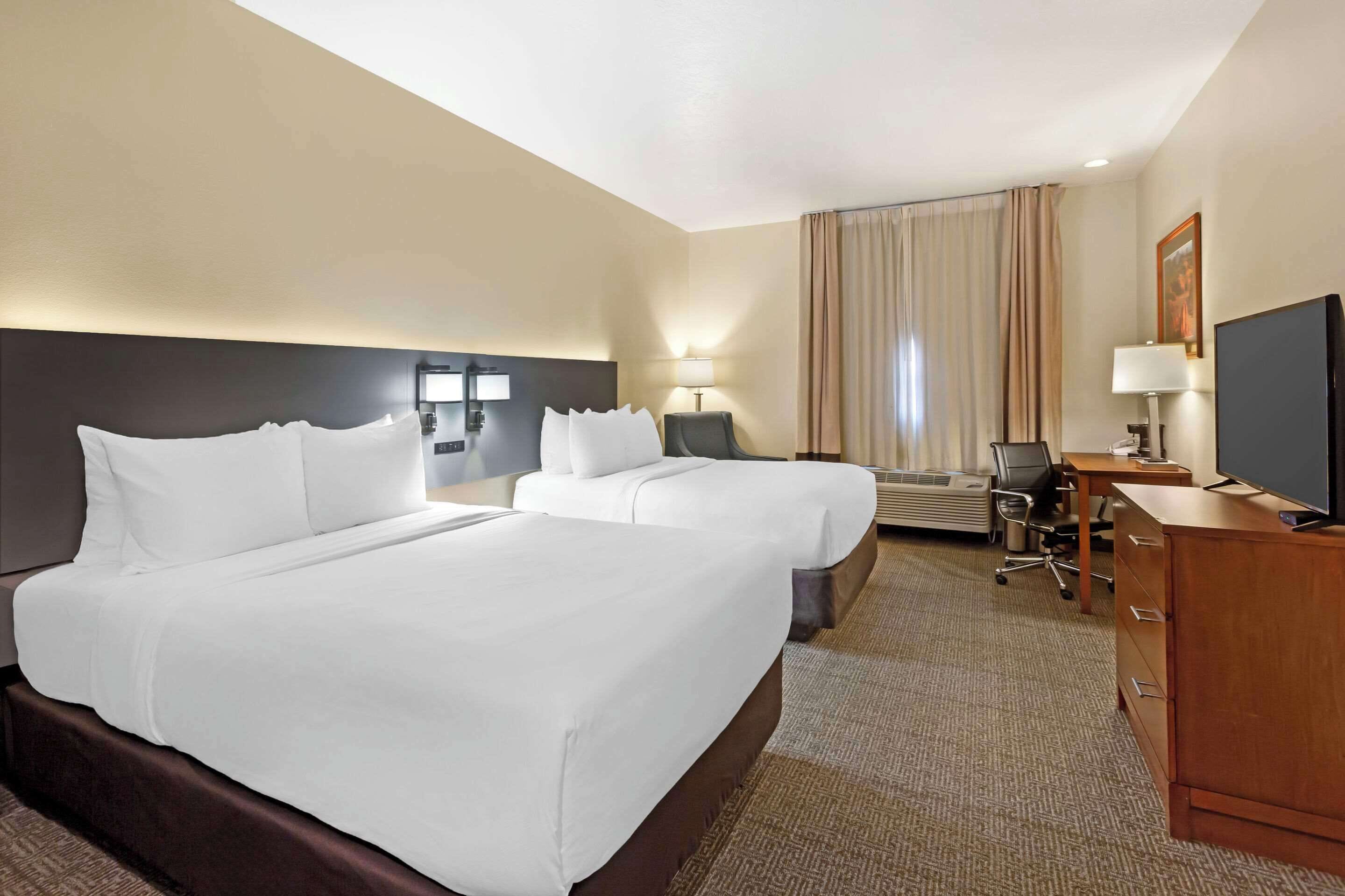 standard room, 2 queen beds, non smoking | desk, laptop workspace, iron/ironing board, rollaway beds