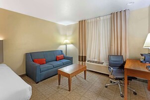 Larger Room, 2 Queen Beds, Non-Smoking | Desk, laptop workspace, iron/ironing board, rollaway beds