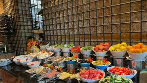 A buffet with various food items and utensils. - Puding Hotel (Antalya)