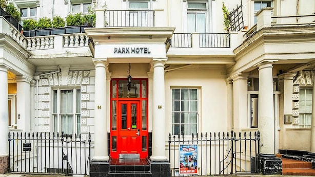 A historic building with a red entrance door, columns, and a sign reading "PARK HOTEL". - The Park Hotel (London)