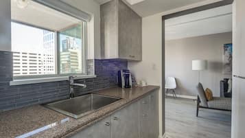 Standard 2-Bedroom Suite (1 King + 2 Twins) | Private kitchen | Fridge, microwave, oven, stovetop