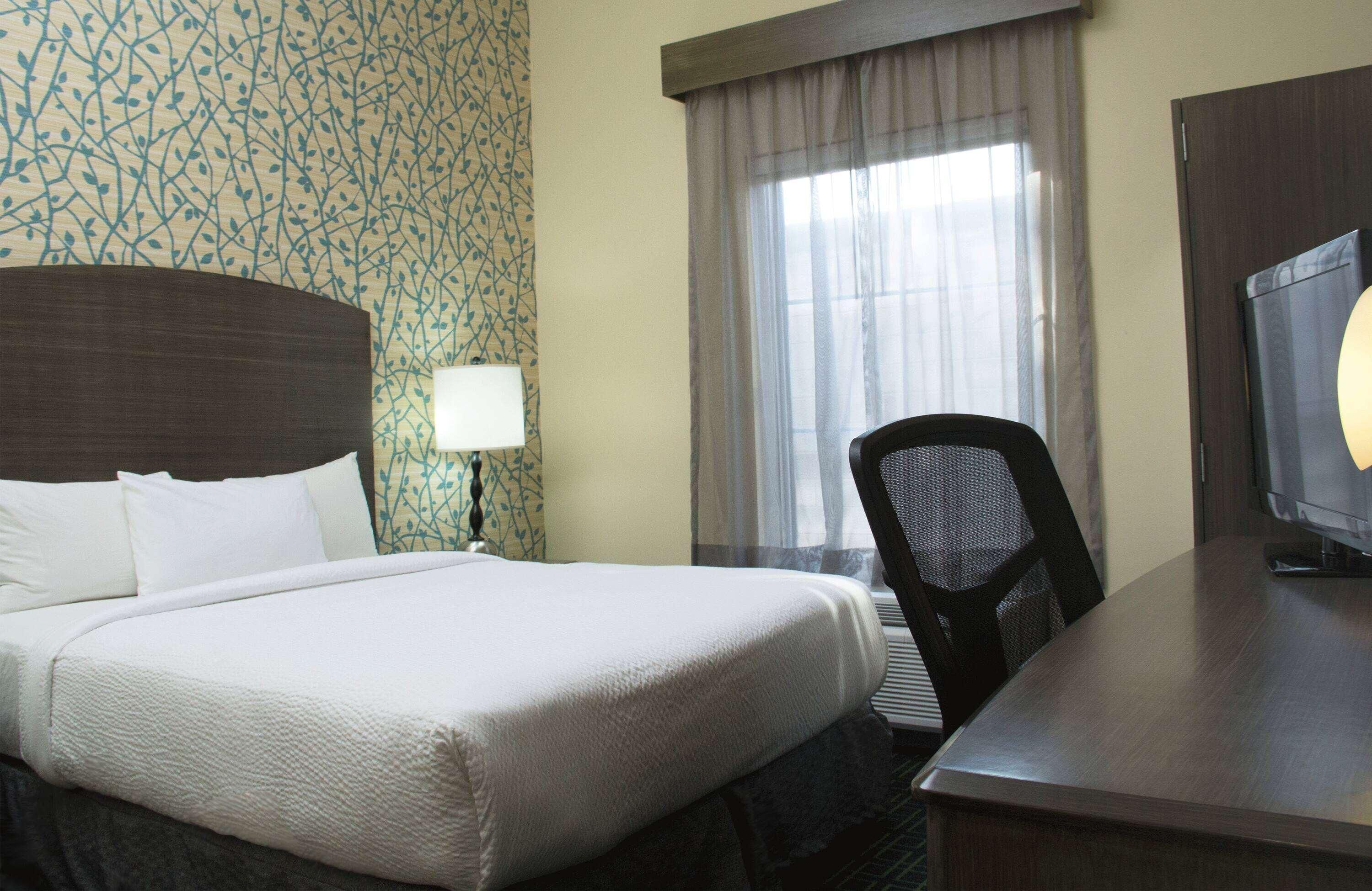 Premium bedding, down duvets, in-room safe, desk