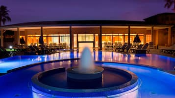 Indoor pool, outdoor pool, pool umbrellas, pool loungers