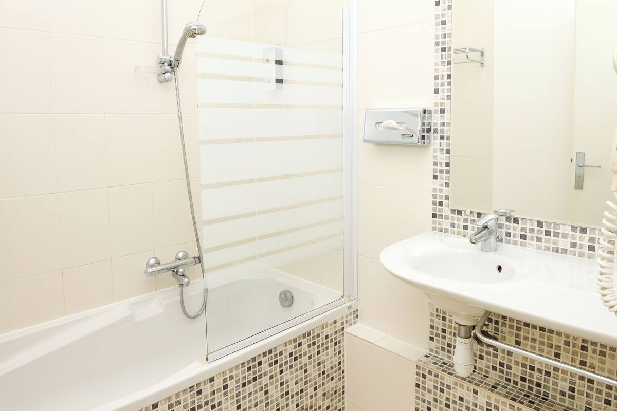 standard twin room | bathroom | eco-friendly toiletries, hair dryer, towels, soap