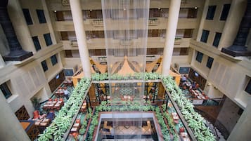 Experience the airy, open space of our atrium, surrounded by balconies and lush greenery.