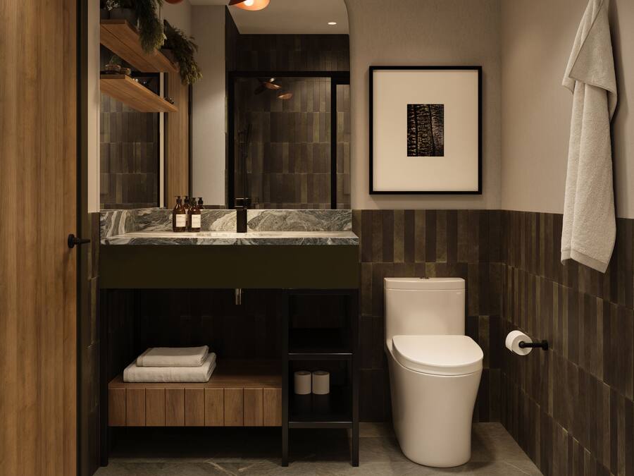 Une salle de bain moderne avec un meuble-lavabo en bois, des toilettes et un tableau encadré au mur.