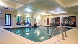 An indoor swimming pool with clear water, a lifeguard chair, and a pool ladder. - Courtyard by Marriott Newark Granville (Newark)