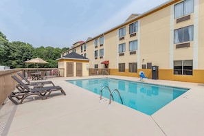 Seasonal outdoor pool, pool loungers