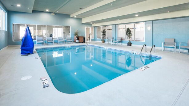 An indoor swimming pool with clear blue water, surrounded by white walls and windows. - Holiday Inn Express & Suites Chattanooga (East Ridge) by IHG (Chattanooga)