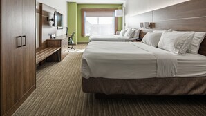 A hotel room with two beds, a desk, a chair, a TV, and a window with a view. - Holiday Inn Express & Suites Chattanooga (East Ridge) by IHG (Chattanooga)