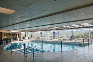 Seasonal outdoor pool, open 10:00 AM to 8:00 PM, pool loungers