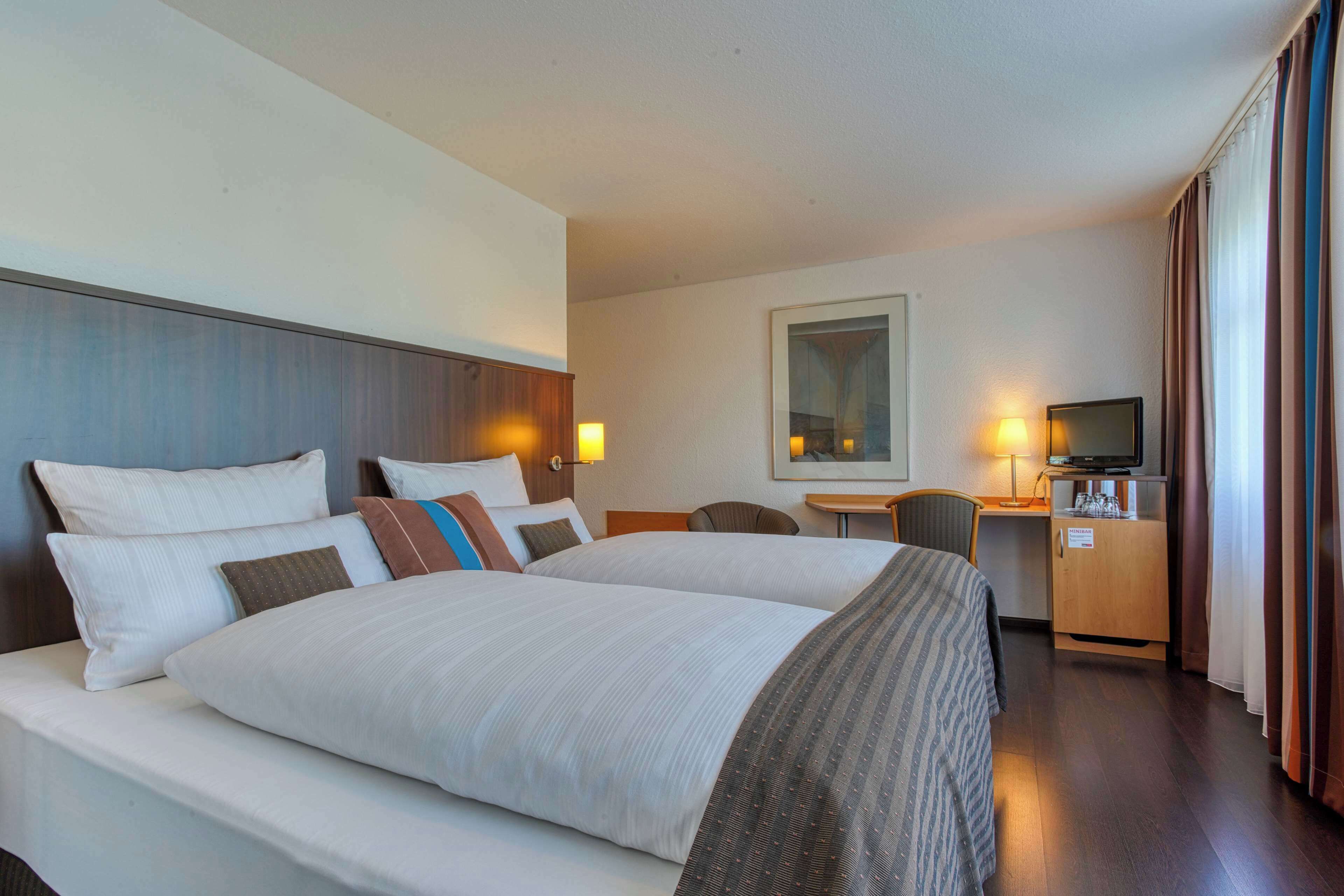 Desk, blackout drapes, WiFi, bed sheets