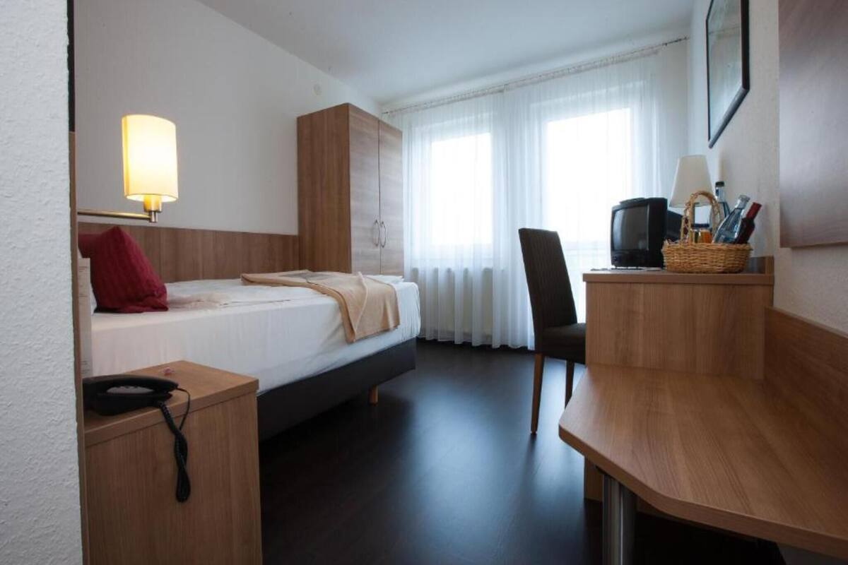 Desk, blackout curtains, WiFi, bed sheets