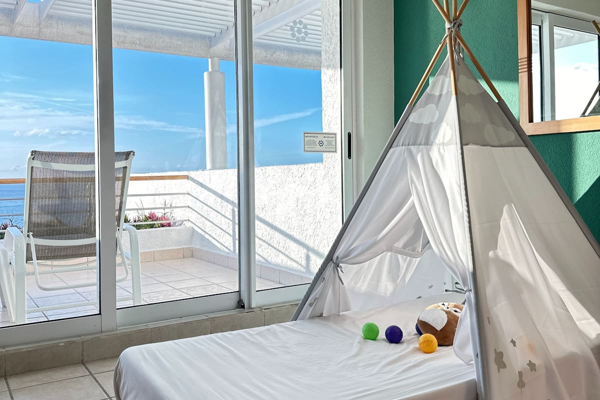 deluxe room, balcony, ocean view | in-room safe, desk, laptop workspace, blackout curtains