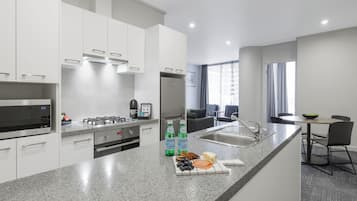 Two Bedroom Apartment | Private kitchen | Full-size fridge, microwave, oven, stovetop