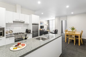 Two Bedroom Apartment | Private kitchen | Full-sized fridge, microwave, oven, stovetop