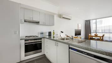 Executive One Bedroom Apartment | Private kitchen | Full-sized fridge, microwave, oven, stovetop