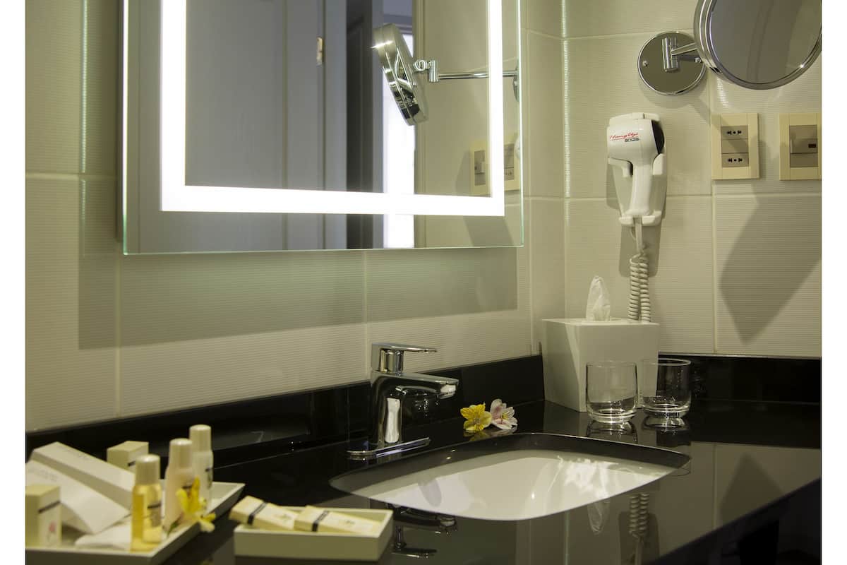 designer toiletries, hair dryer, bathrobes, towels