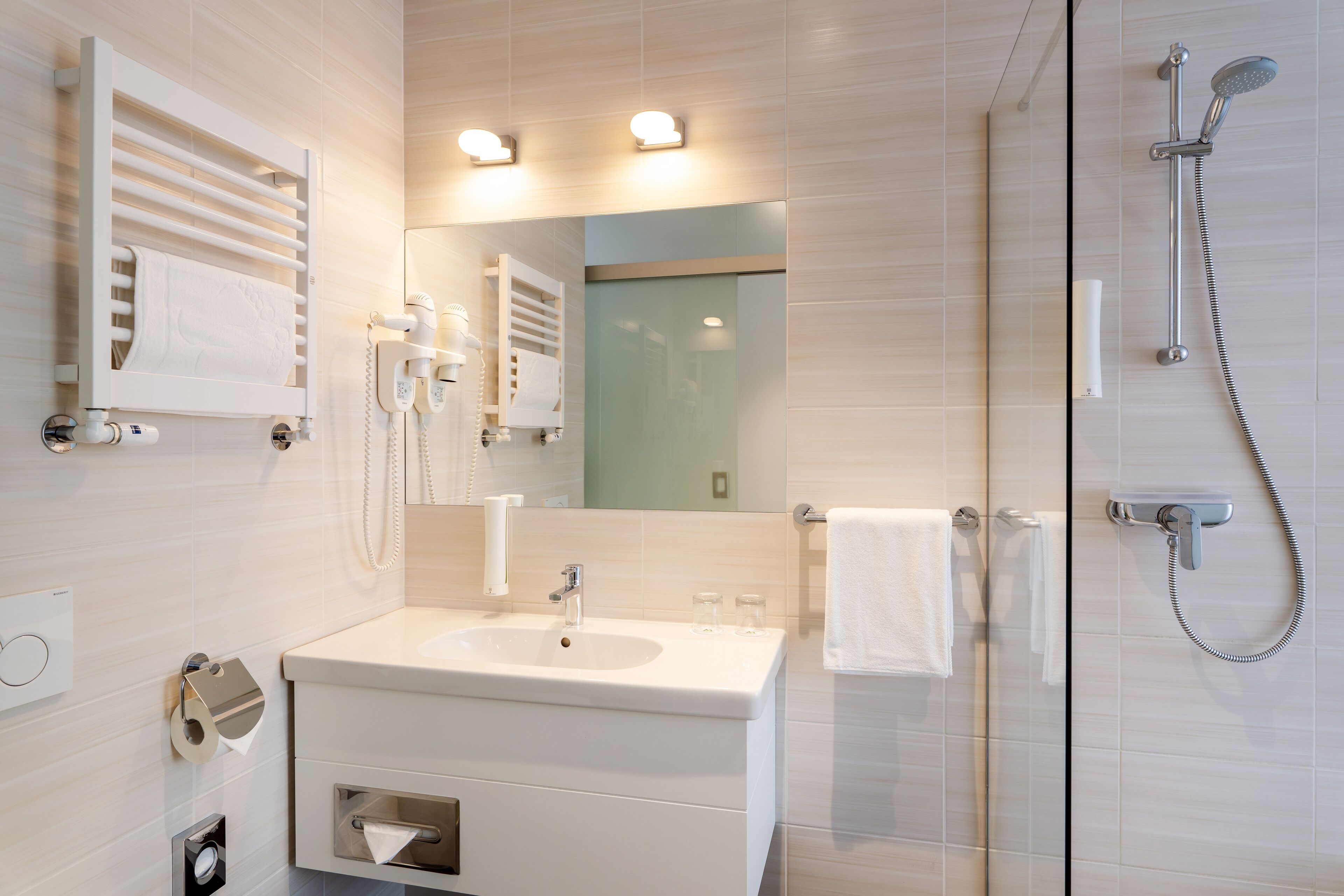 shower, hair dryer, towels, soap