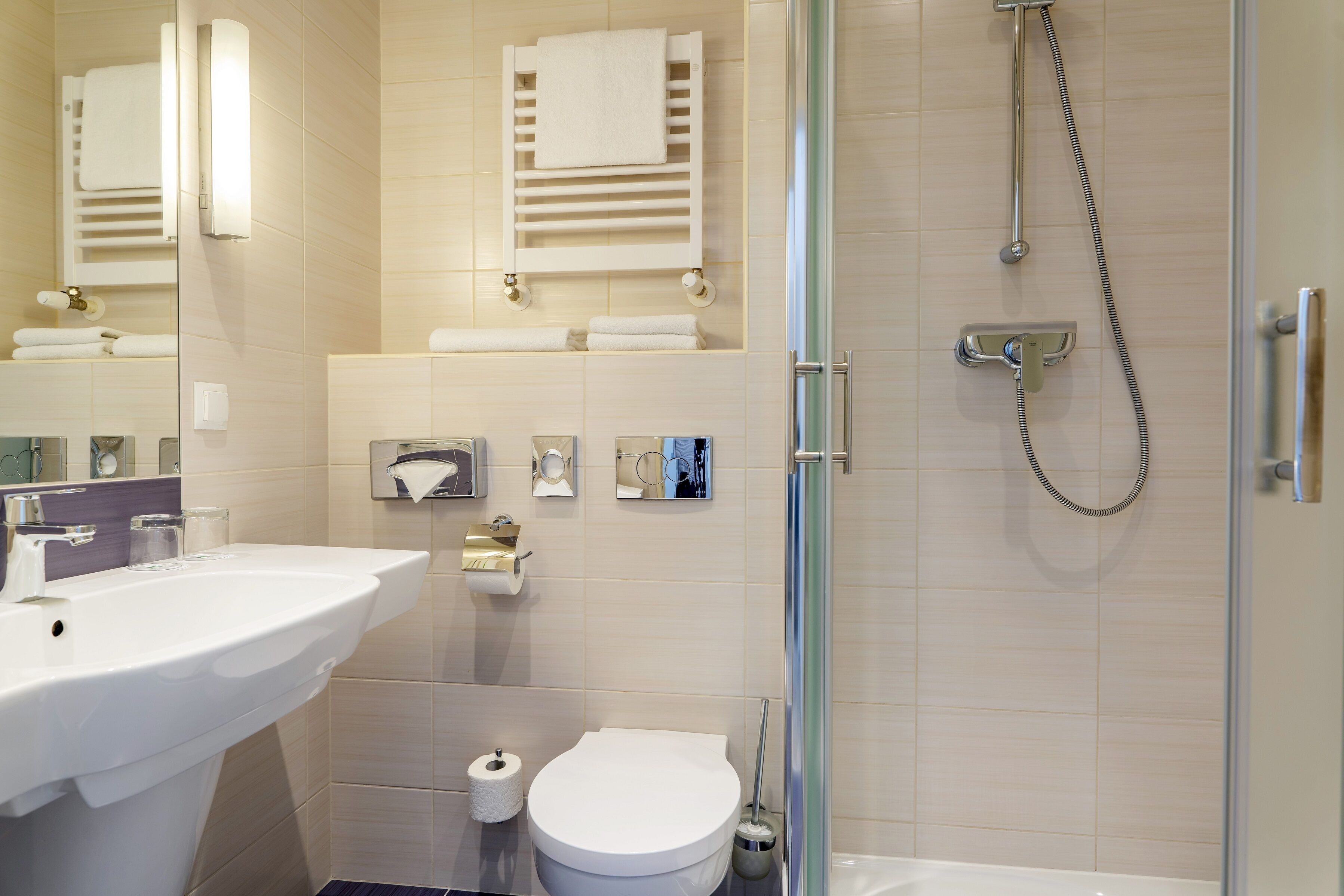 standard twin room | bathroom | shower, hair dryer, towels, soap