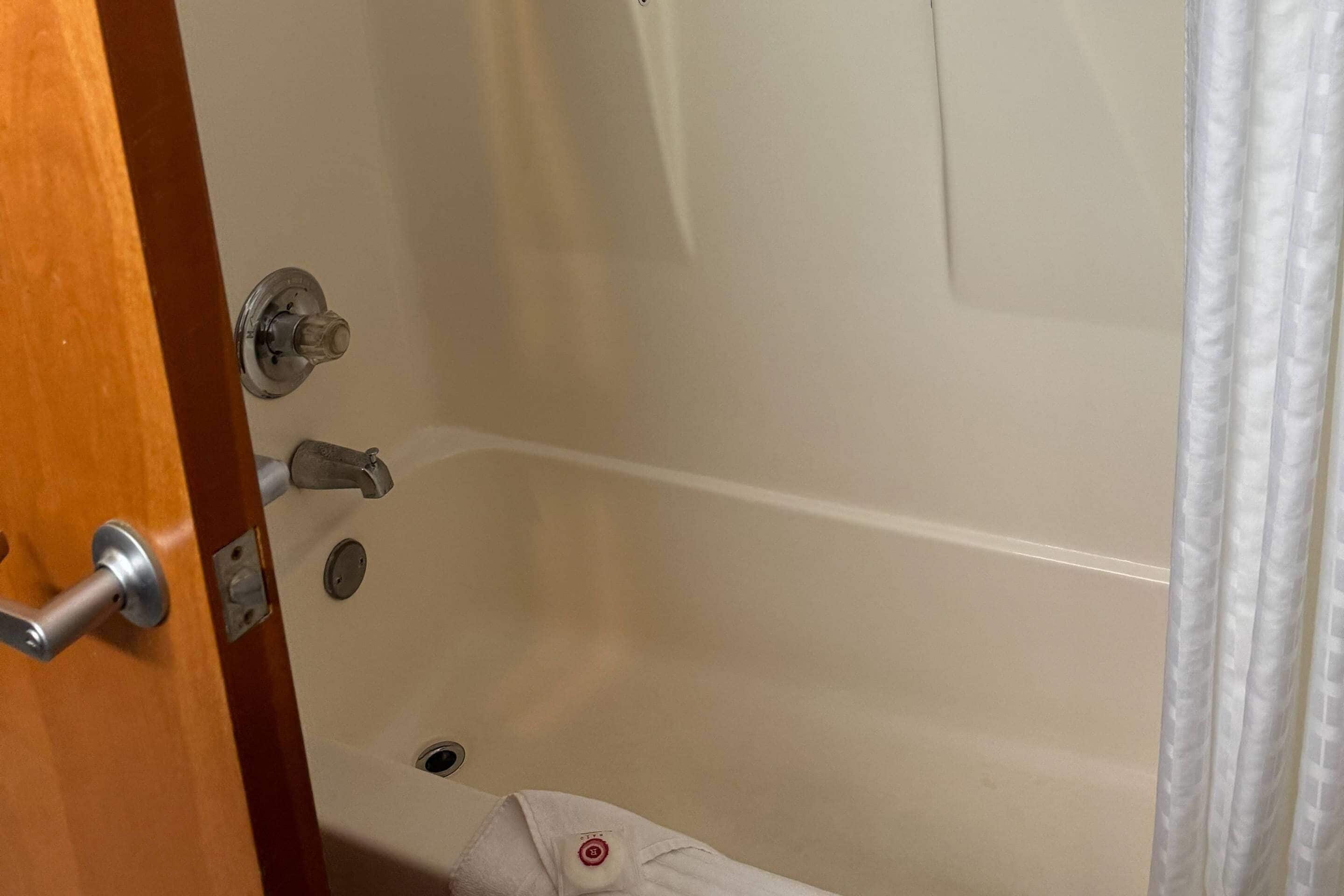 A bathroom with a bathtub, a shower, and a toilet.