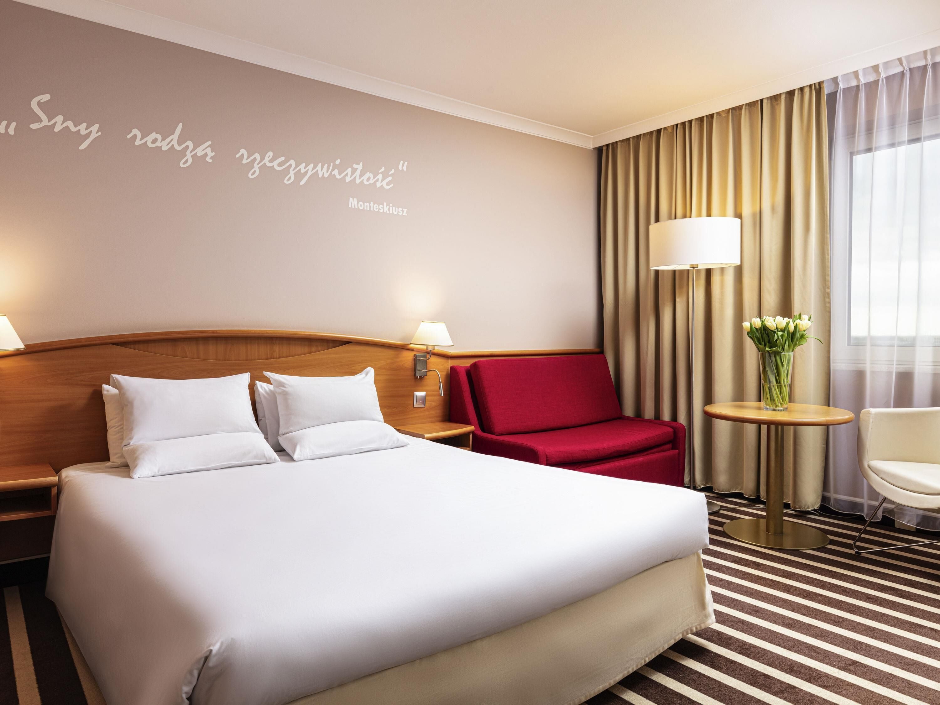 Hypo-allergenic bedding, desk, laptop workspace, blackout drapes
