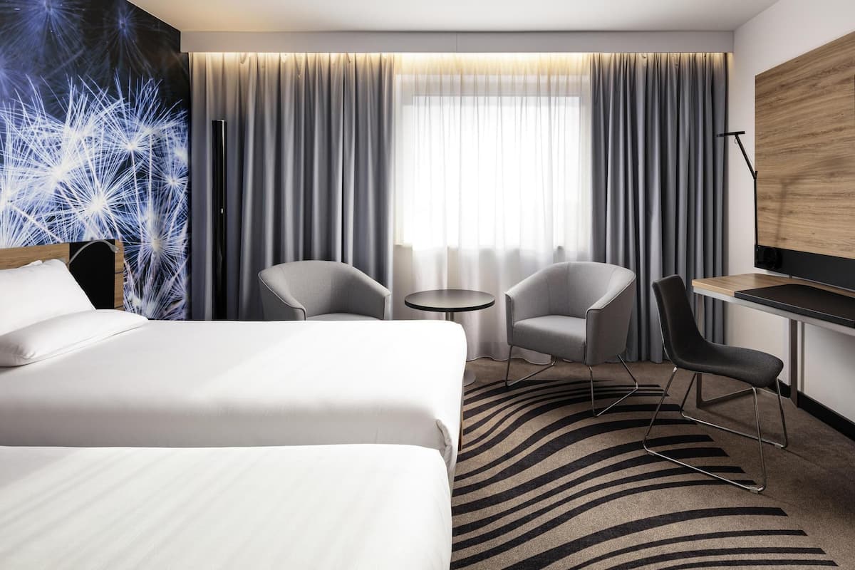 Hypo-allergenic bedding, desk, laptop workspace, blackout curtains
