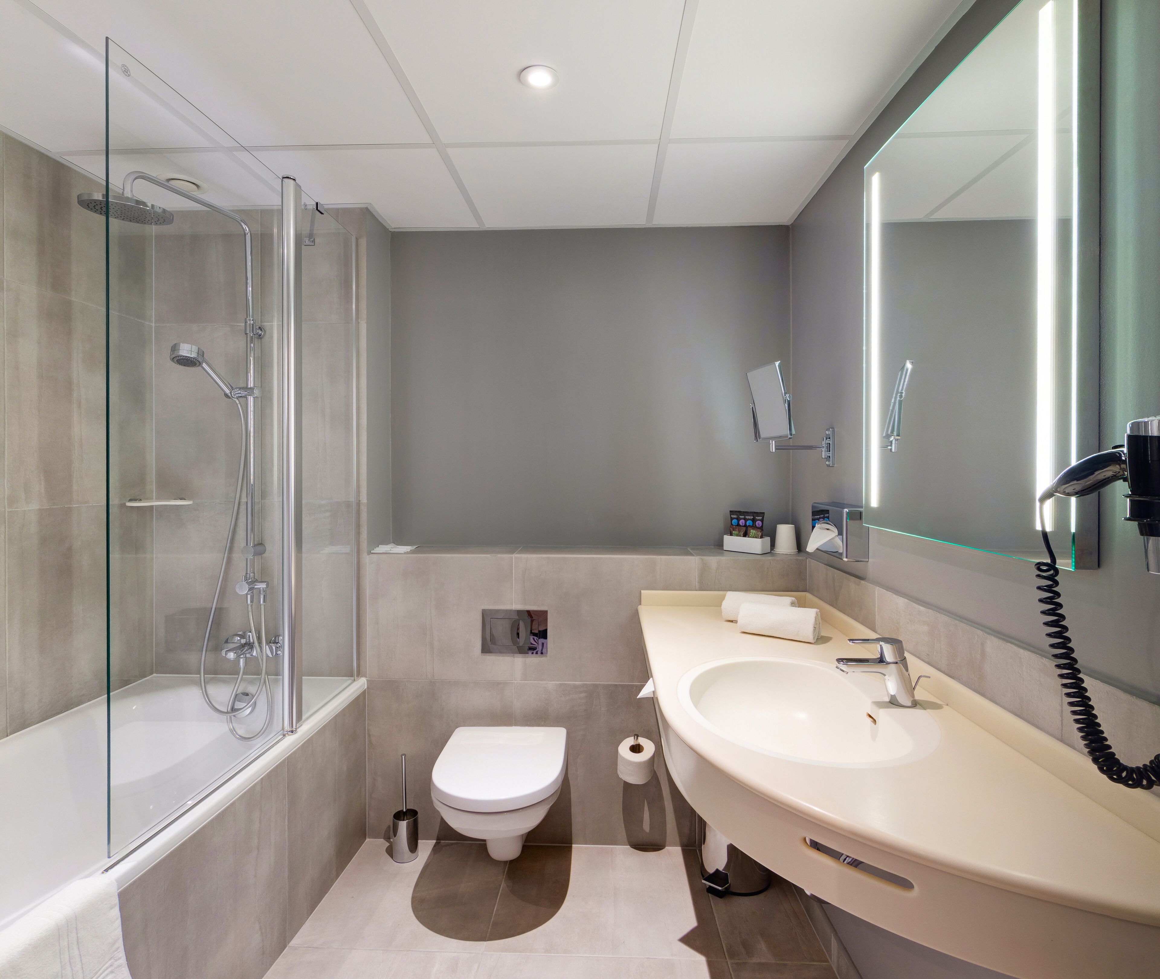 eco-friendly toiletries, hair dryer, towels